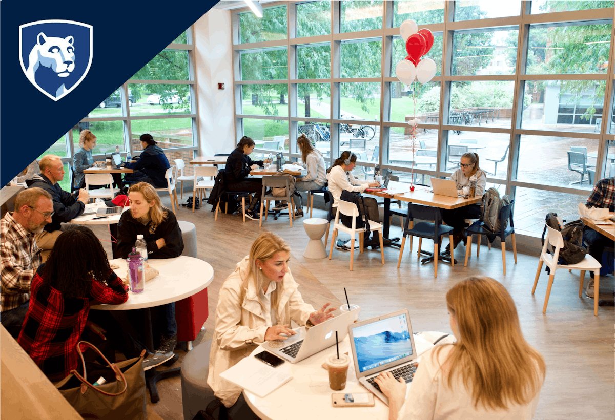 a group of people sitting at a table in saxbys penn state