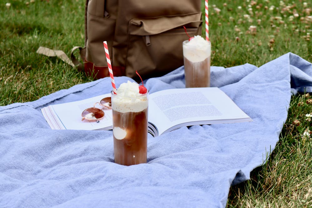 a woman sitting at a picnic table