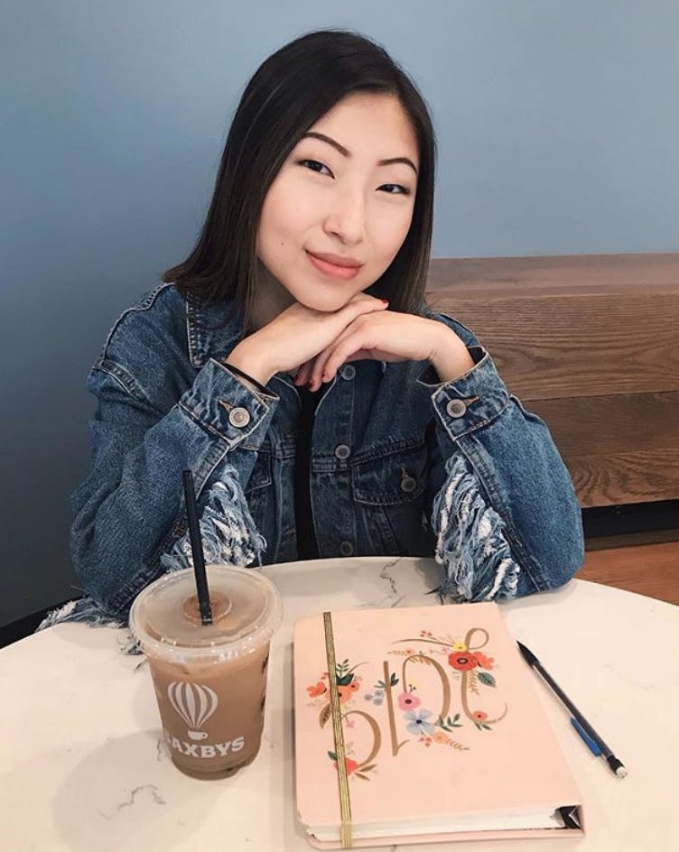 a woman sitting on a table