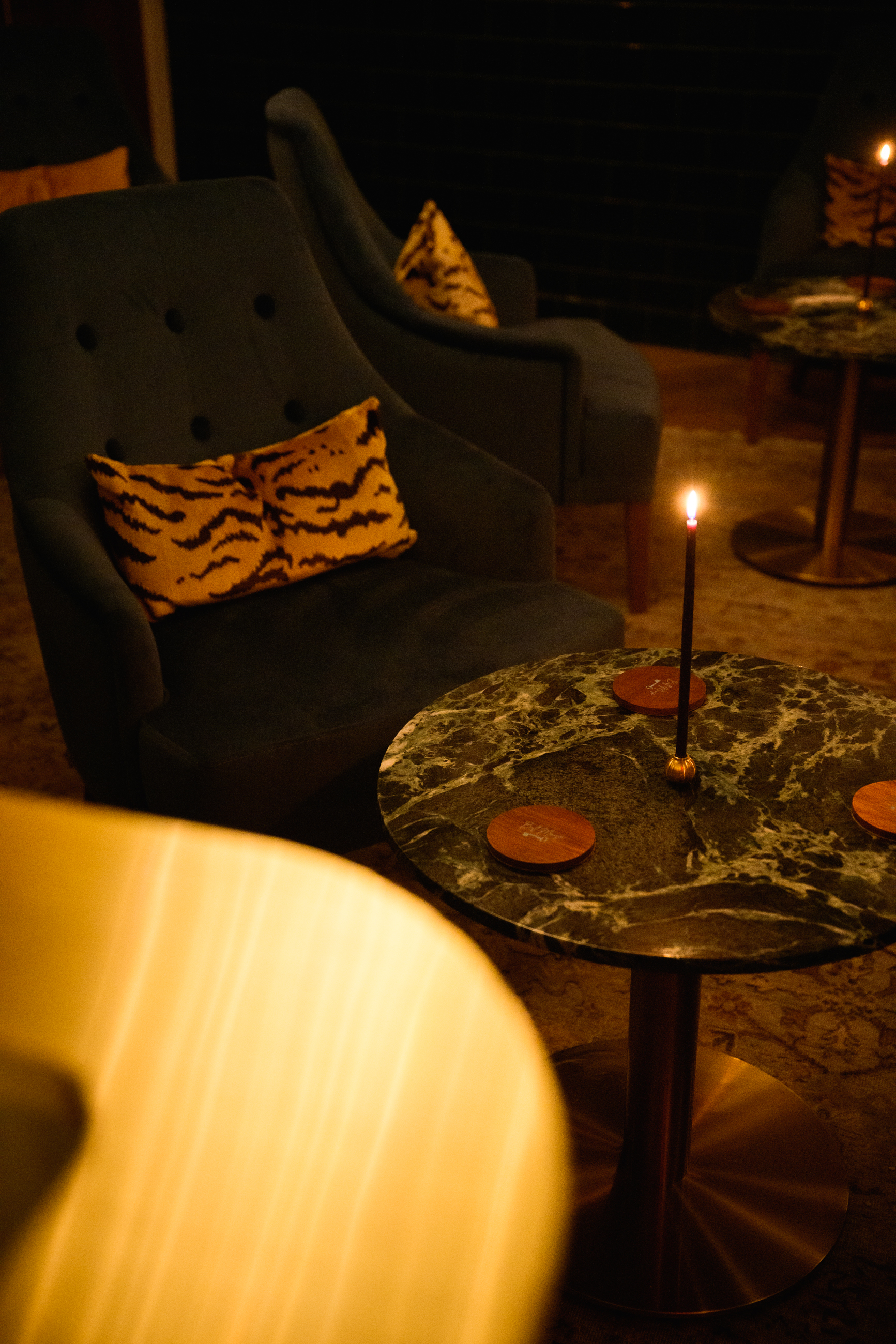 a cake with lit candles sitting on a table