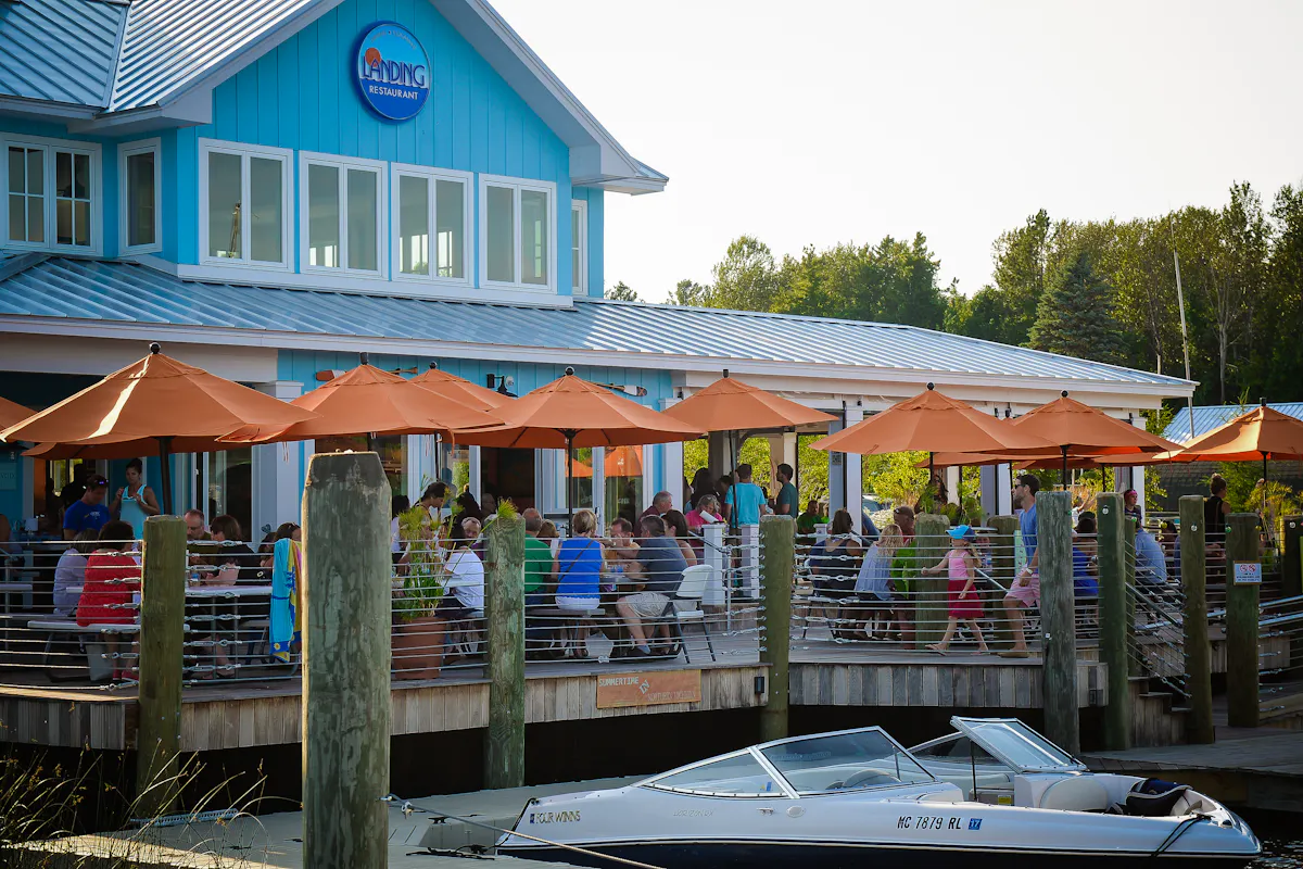 The dock with a boat next to the restaurant