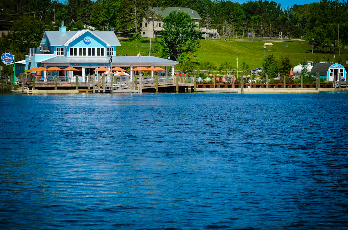 a boat is docked next to a body of water