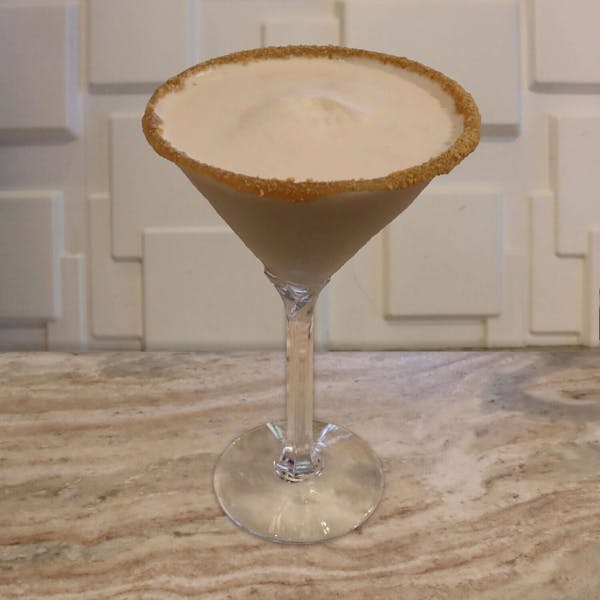 Frangelico, Dr. McGillicuddy’s Vanilla, Buttershots, Splash of Cream, Caramel, Molasses Bitters. Garnished with A Caramel and Graham Cracker Rim