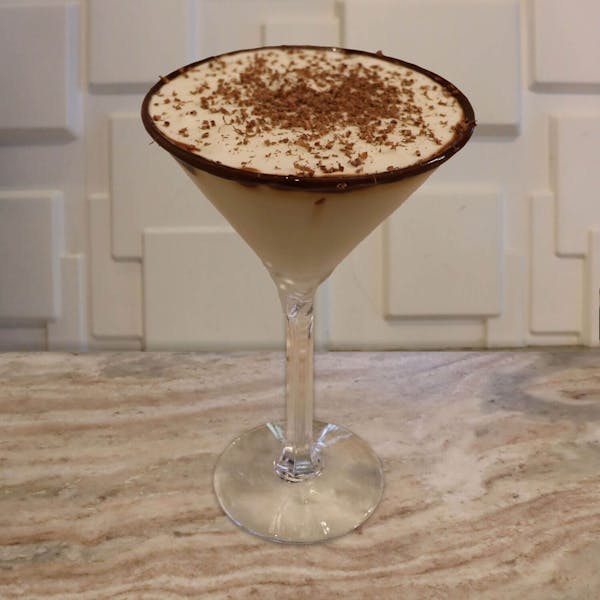 Chocolate Vodka, Crème De Cacao, Crème De Banana, a Splash of Cream, and Chocolate Shavings with A Chocolate Rim