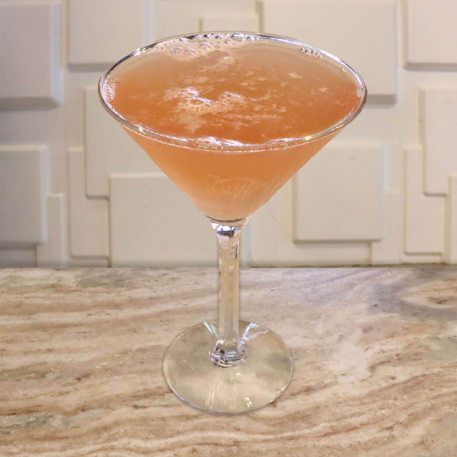 Pomegranate Vodka, Pama Liqueur, Triple Sec, and Orange Juice