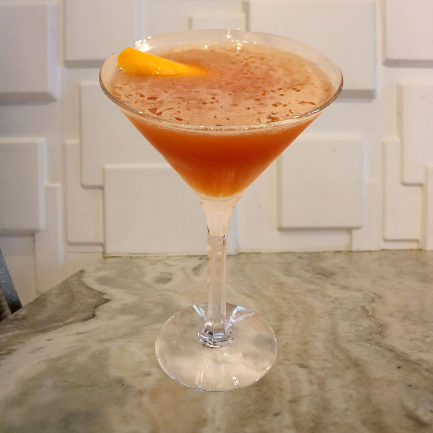 Bourbon, Sweet Vermouth, and Aperol. Garnished With an Orange Twist