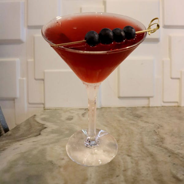 Pomegranate Vodka, Raspberry Schnapps, Cherry Pucker, Cranberry Juice. Garnished with 3 Fresh Blueberries