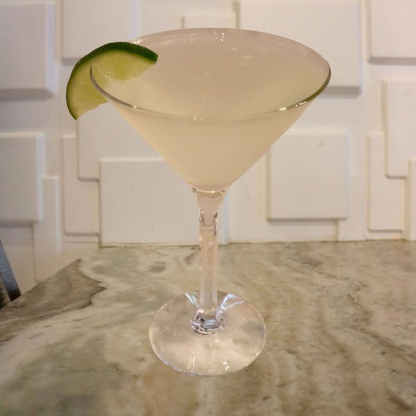 Bacardà Superior Rum, Lime Juice, Simple Syrup. Garnished With a Lime Slice