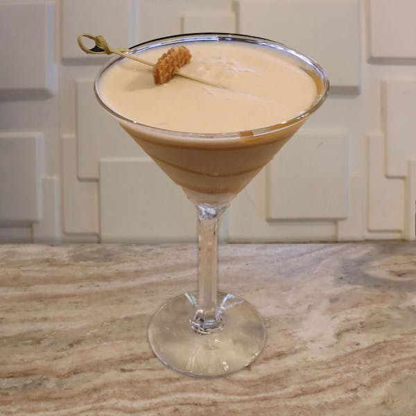 Caramel Vodka, Buttershots, Irish cream, RumChata, and a splash of cream. Garnished with caramel swirls & a stroopwafel bite.