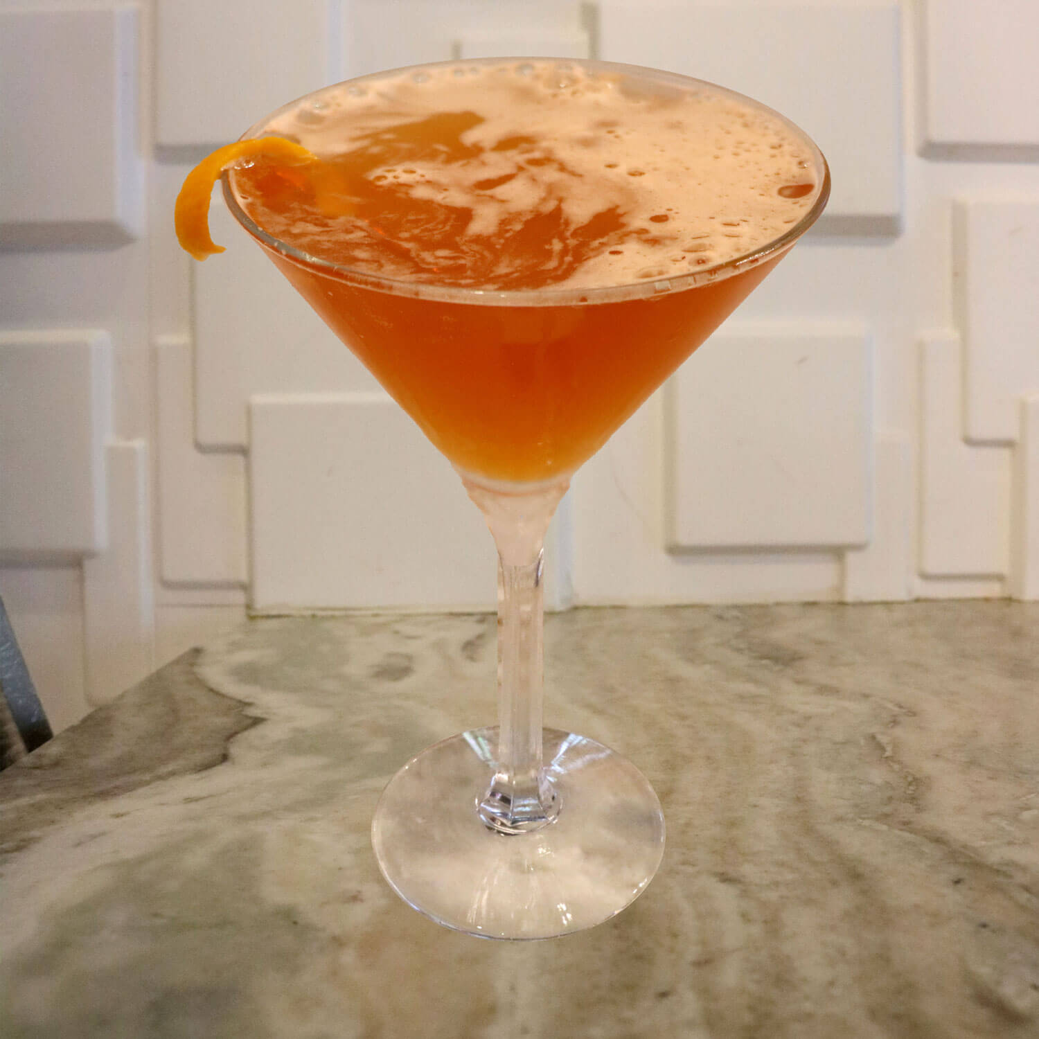 Premium Gin, Simple Syrup, Lemon Juice, Angostura Bitters, Lemon Twist