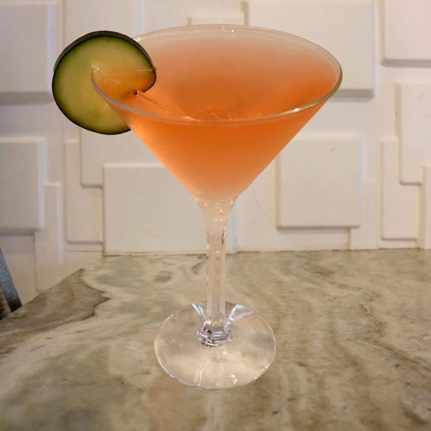 Cucumber Vodka, Watermelon Pucker, Tonic, and Sprite. Garnished With a Cucumber Slice