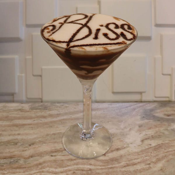 Vanilla Vodka, Coffee Liqueur, Frangelico, White Chocolate Liqueur, Splash of Cream, and Chocolate Swirls