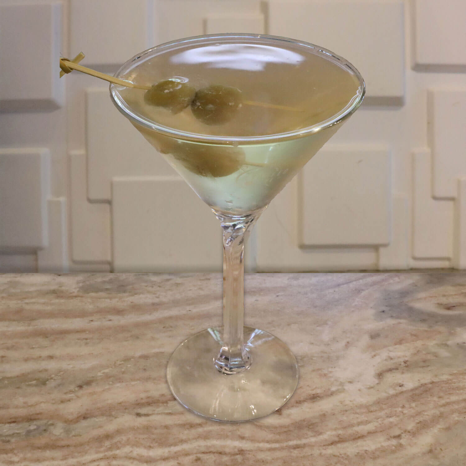 Premium Gin or Vodka, Olive Brine. Garnished with Your Choice of Stuffed Olives