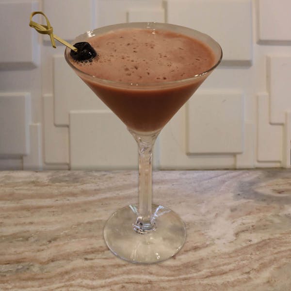 Cherry Vodka, Coffee Liqueur, Chocolate Liqueur, Cherry Pucker, and Cherry Juice. Garnished with A Luxardo Cherry