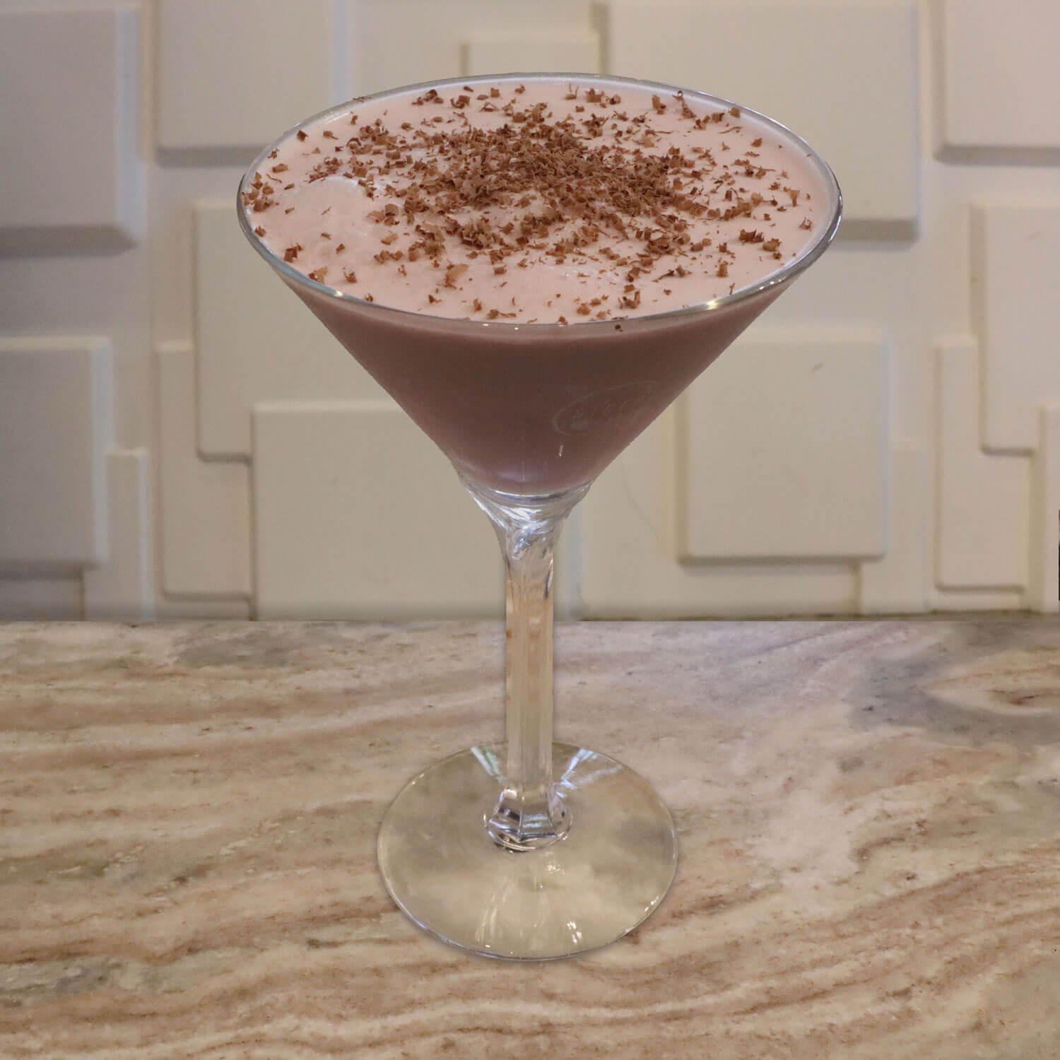 Crème De Cacao, Raspberry Schnapps, and Cream. Garnished with Chocolate Shavings