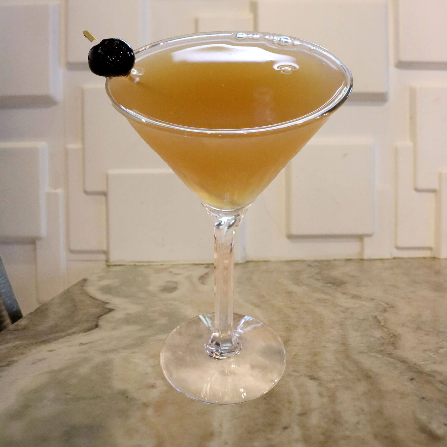 Captain Morgan Spiced Rum, Triple Sec, and Sour. Garnished With a Luxardo Cherry