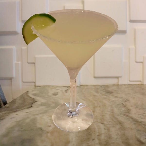Jose Cuervo Tequila, Triple Sec, Lime Juice, Sour. Garnished With a Salt Rim and a Lime Slice