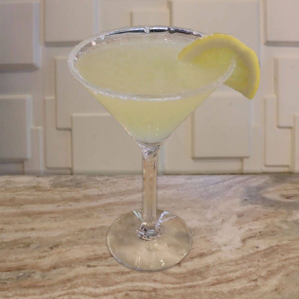 Deep Eddy Lemon Vodka, Limoncello, and Sour. Garnished With a Lemon Slice and Sugar Rim