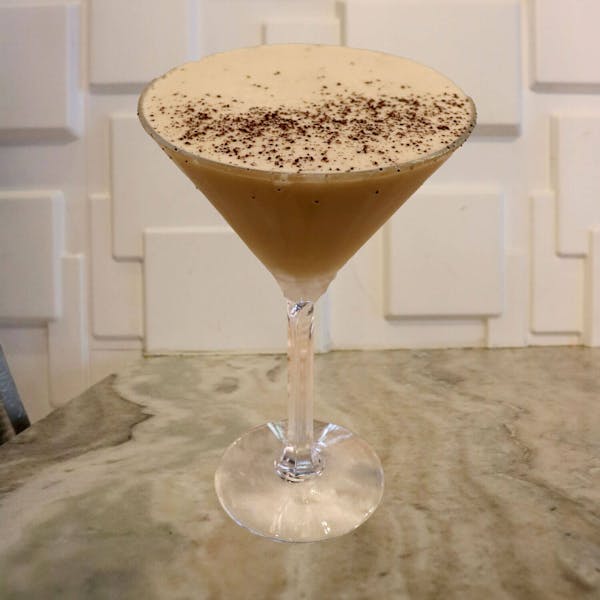 Local Espresso, Caramel Vodka, Coffee Liqueur, a Splash of Cream, and Caramel Shaken in. Garnished With a Sprinkle of Course Ground Coffee Beans on Top