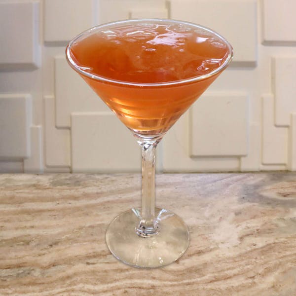 Crown Apple Whiskey, Caramel Vodka, Apple Pucker, and Splash of Cranberry Juice. Garnished With Caramel Swirls and a Caramel Rim