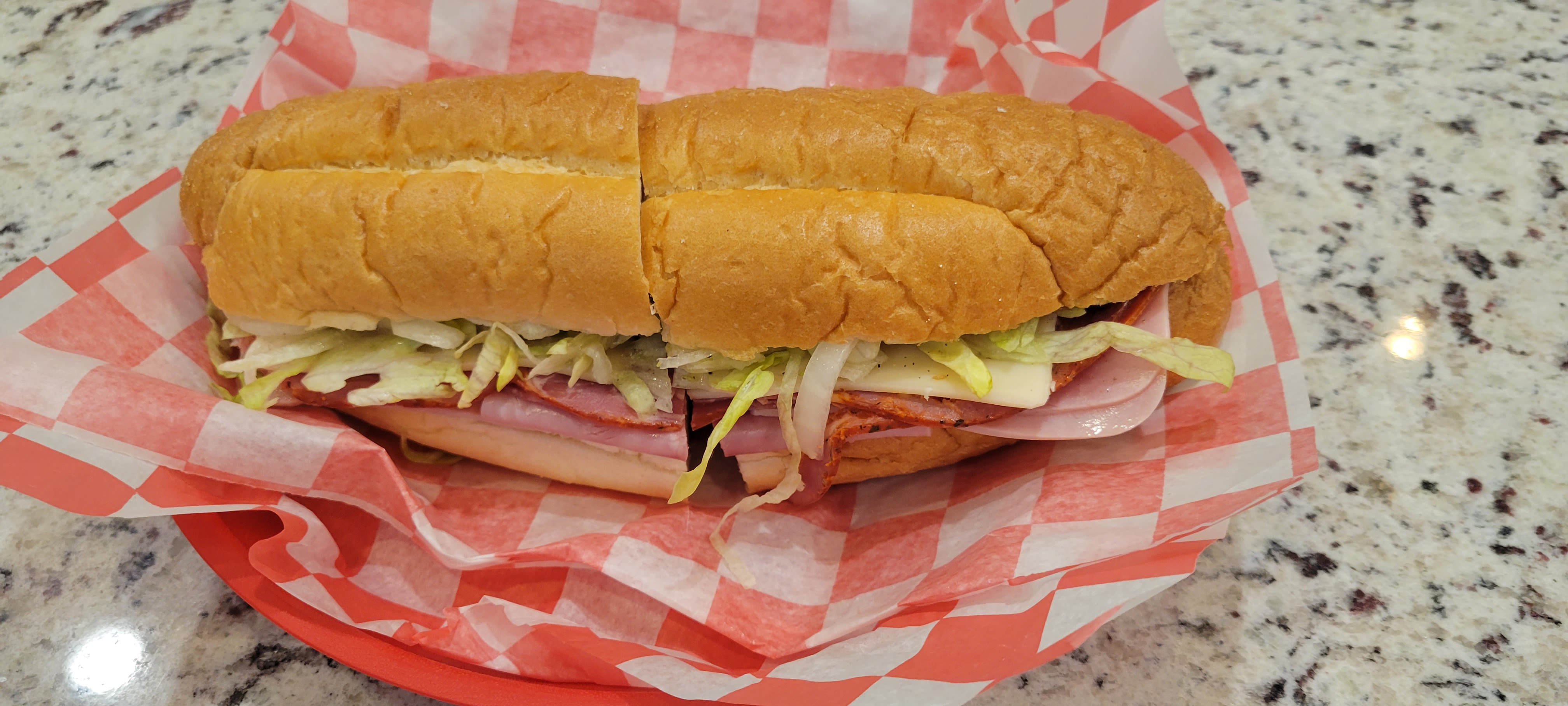 a sandwich cut in half and sitting on a table