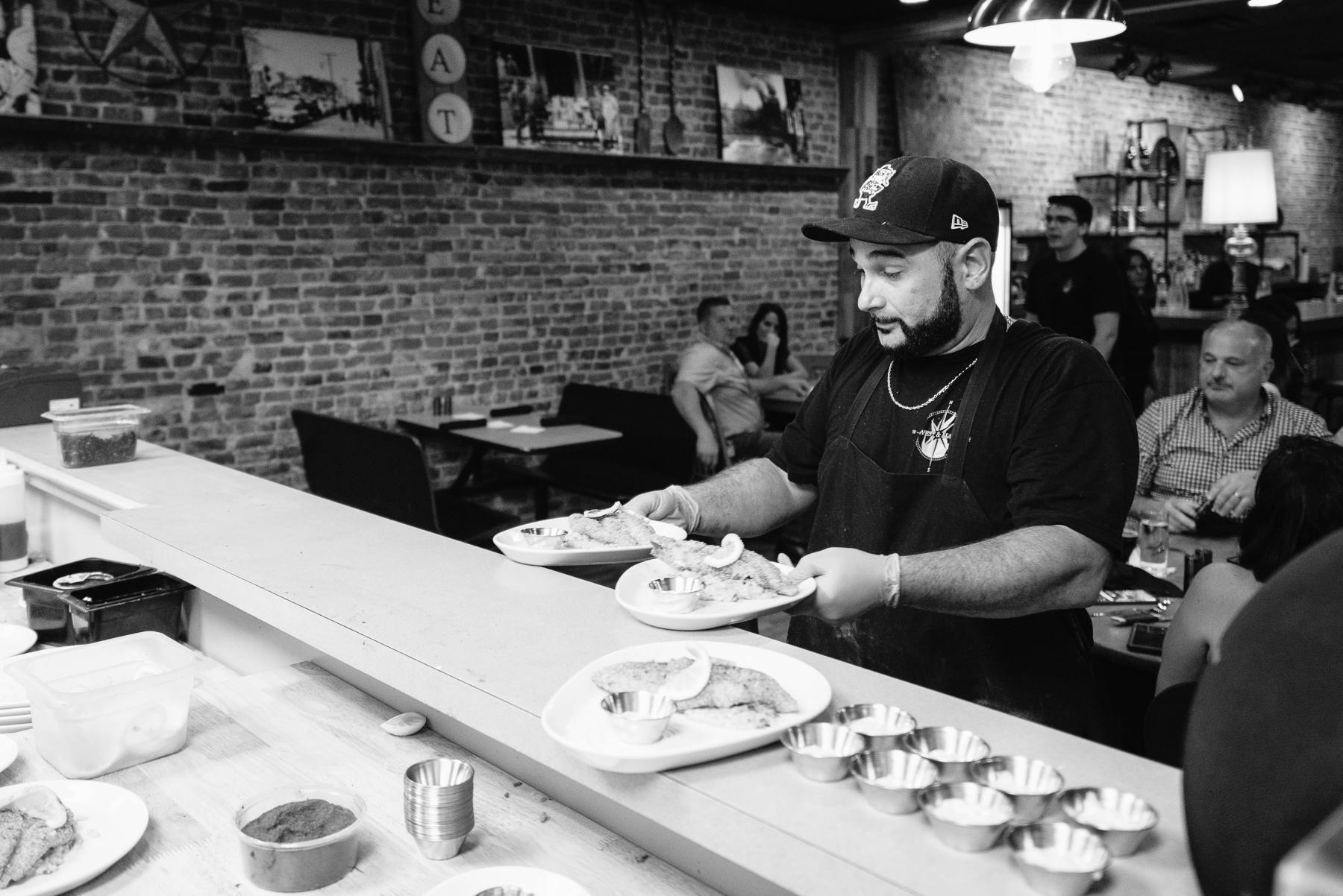 Chef Gabe about to serve meals to guest