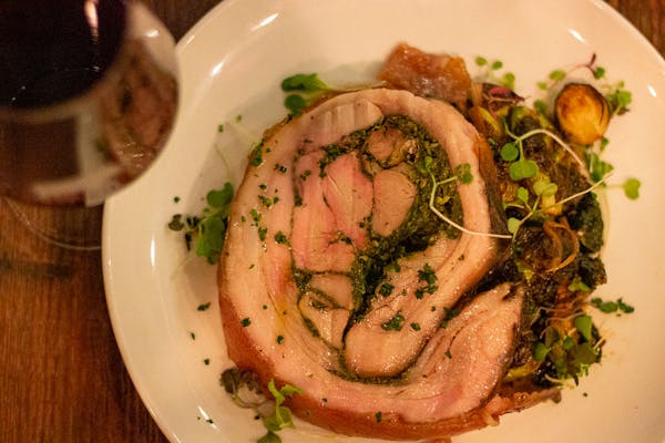 a dish is filled with meat and vegetables on a plate