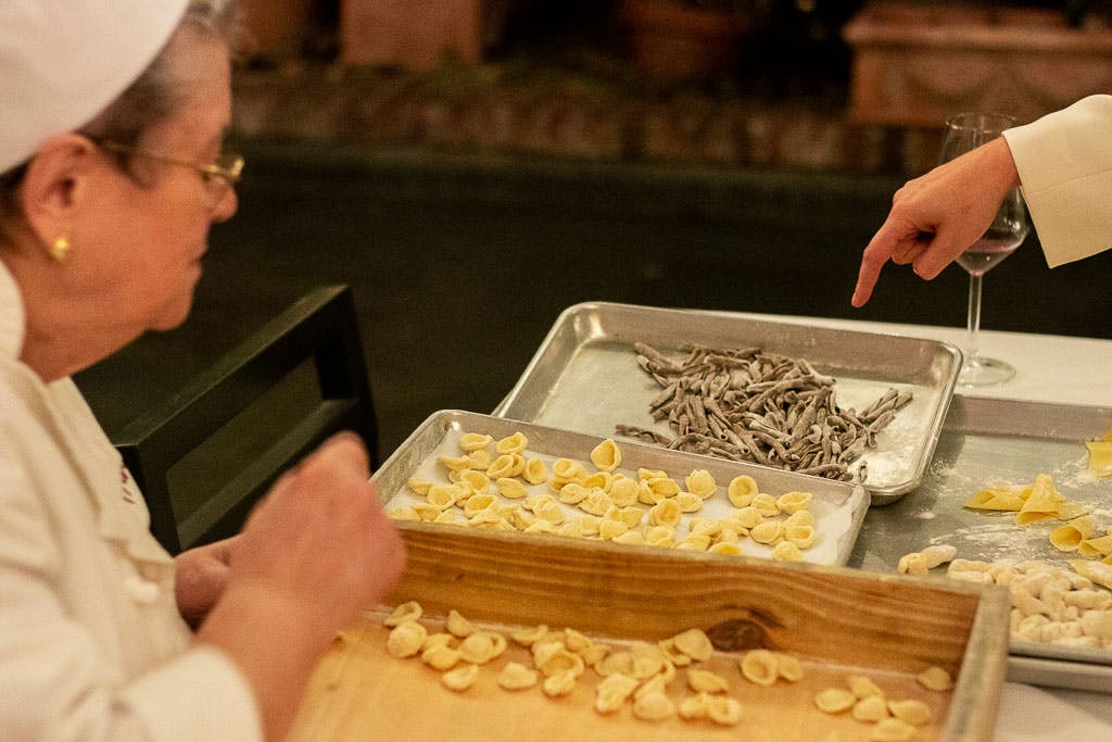 a person cutting food on a table