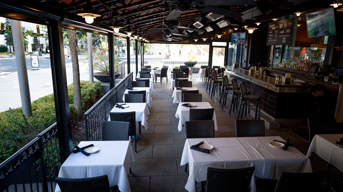 a dining room table in front of a building