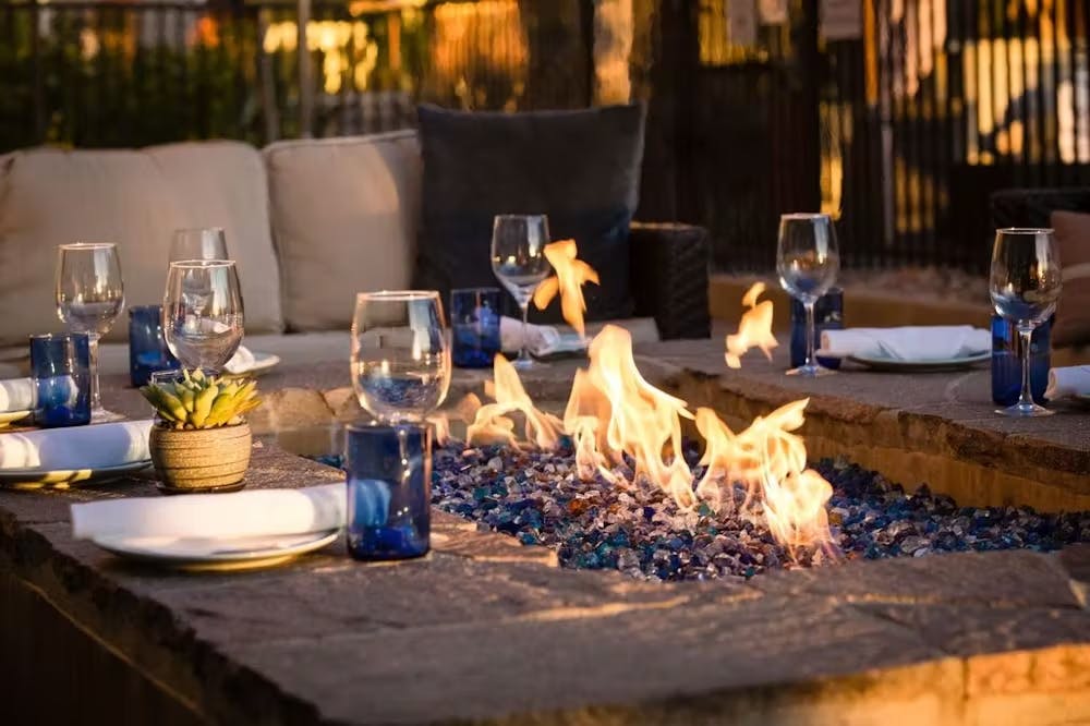 a group of people sitting at a table with wine glasses