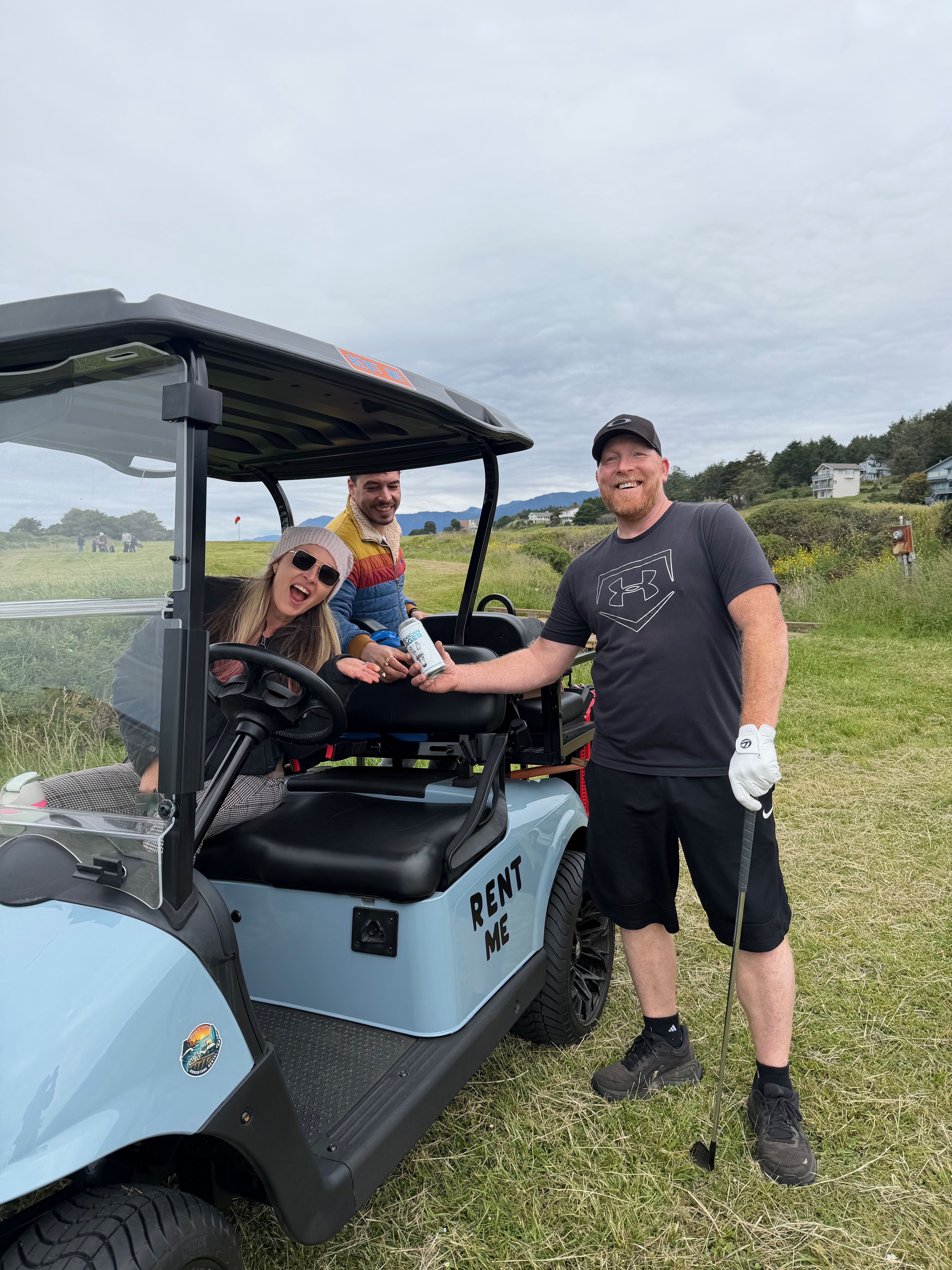 a group of people in a golf cart