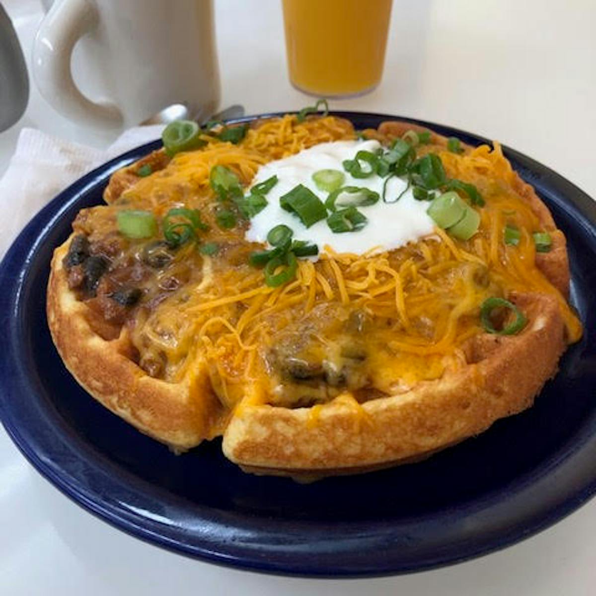 a pizza sitting on top of a plate of food