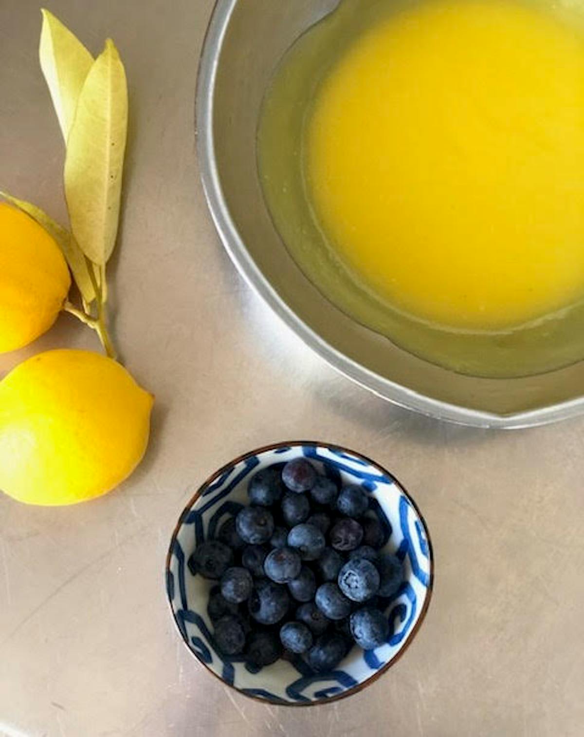 a bowl of oranges on a table