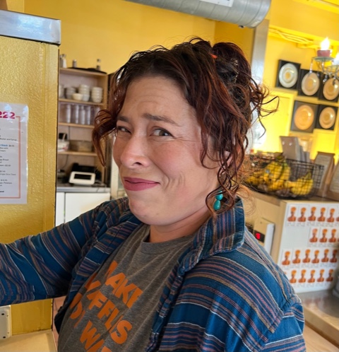 a person standing in front of a restaurant