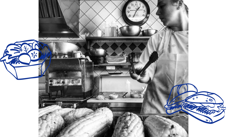 a man that is standing in the kitchen