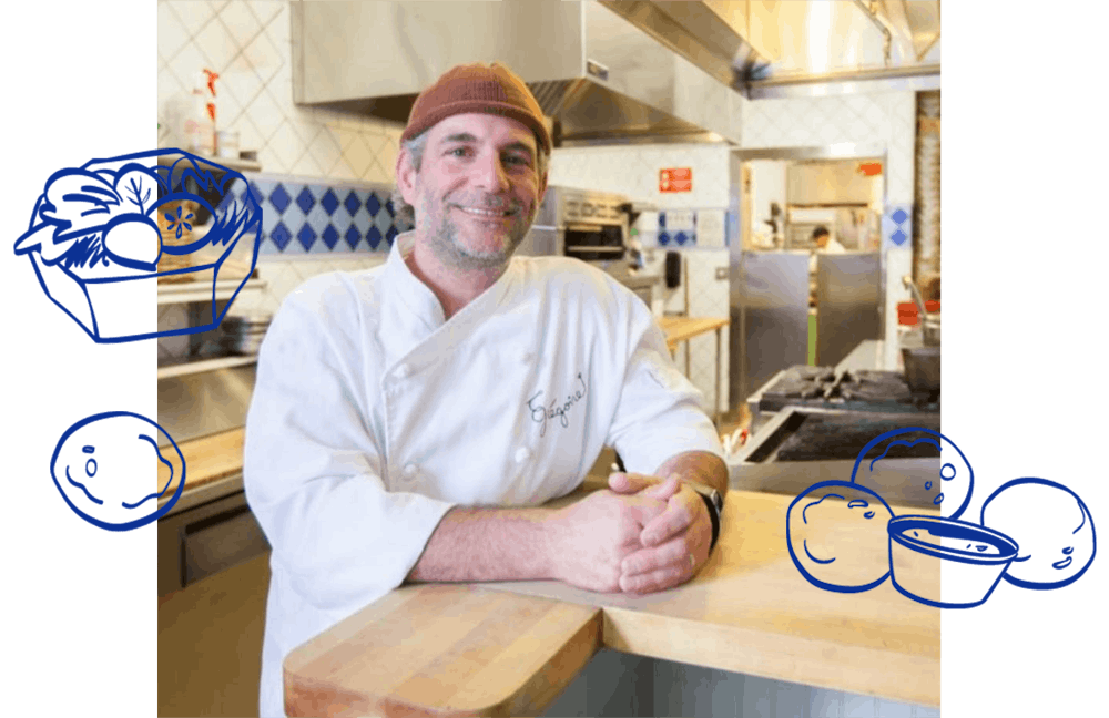 a man preparing food in a kitchen