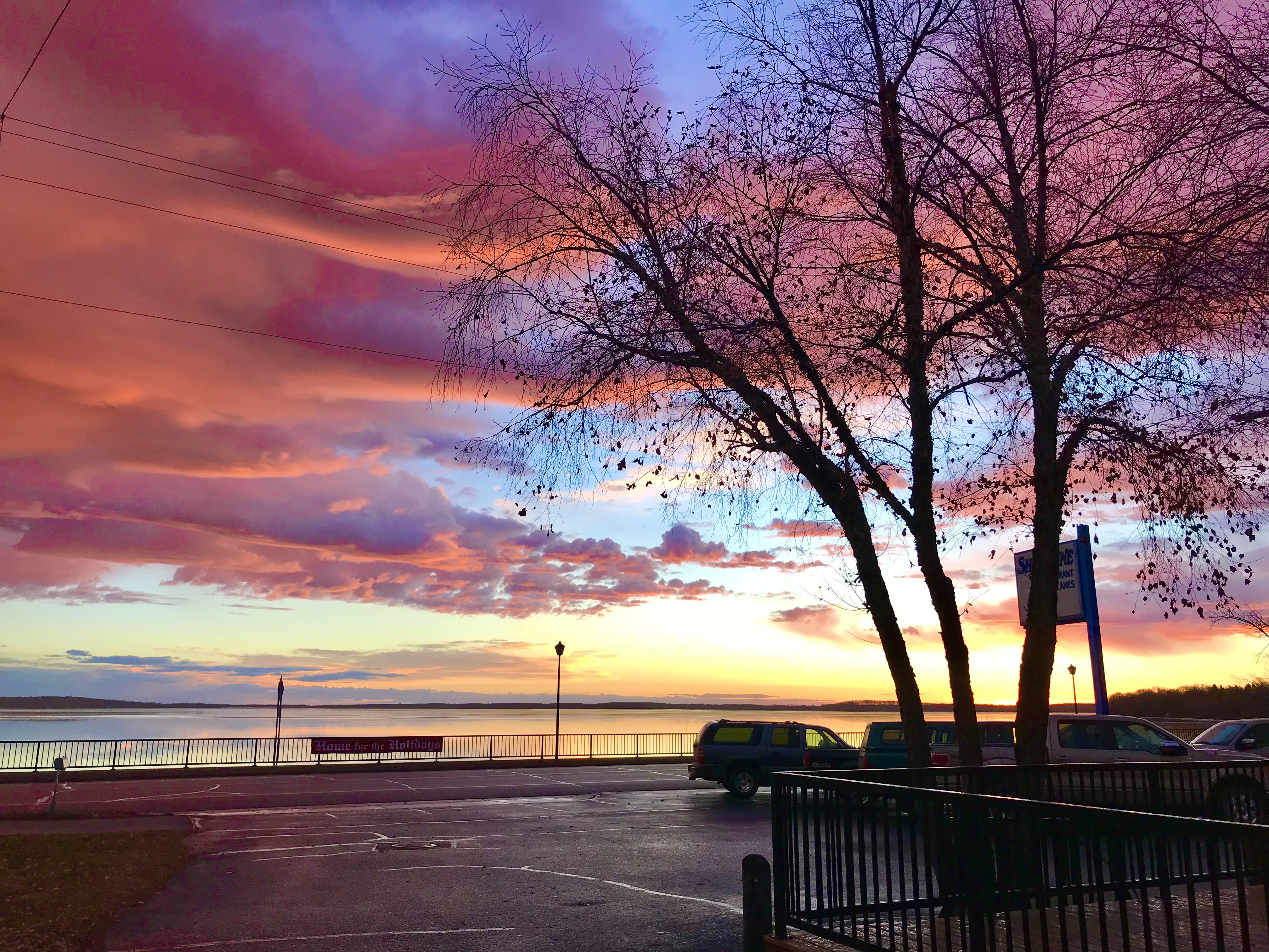 a sunset over a body of water