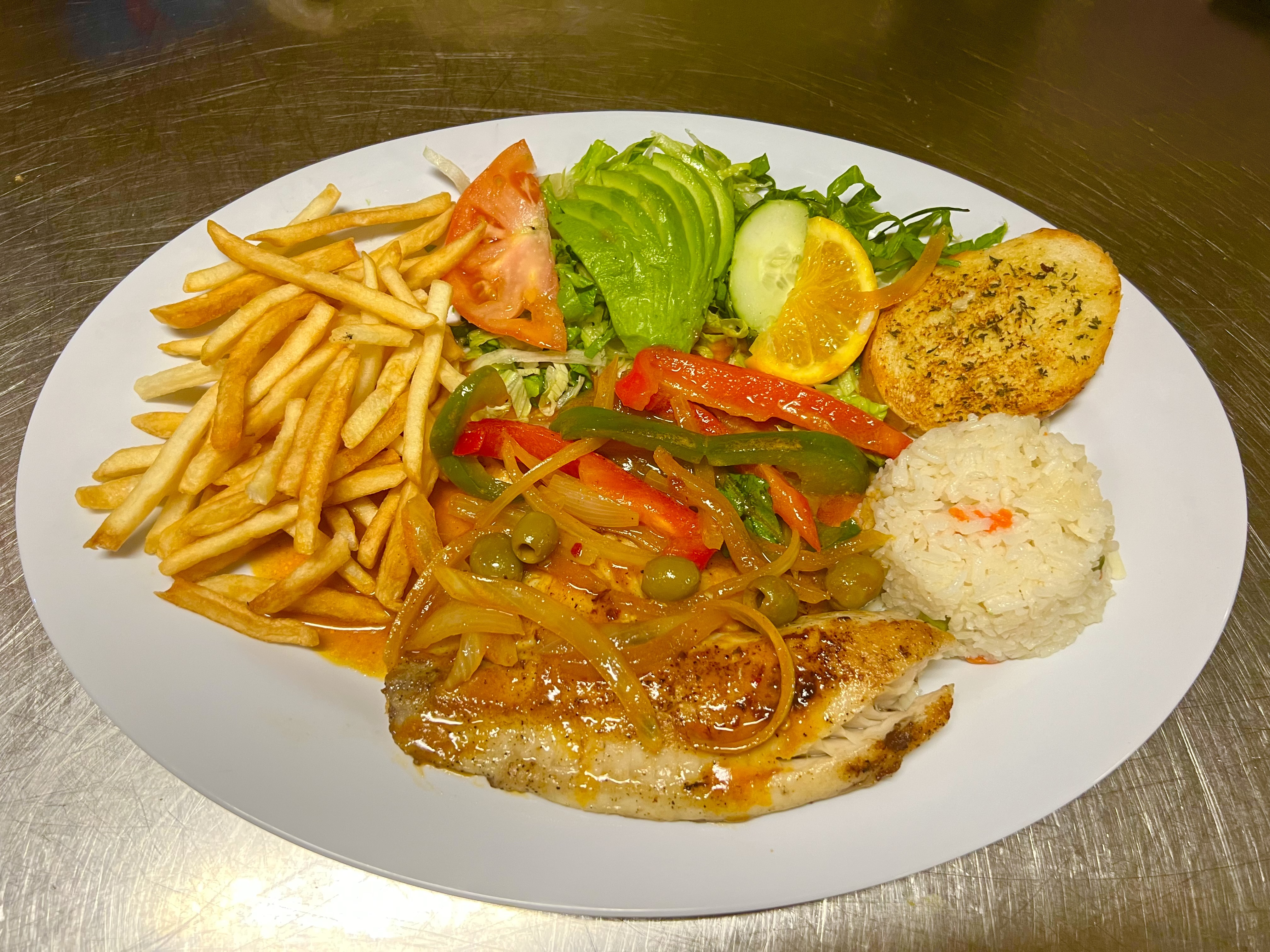 a plate of food with meat and vegetables