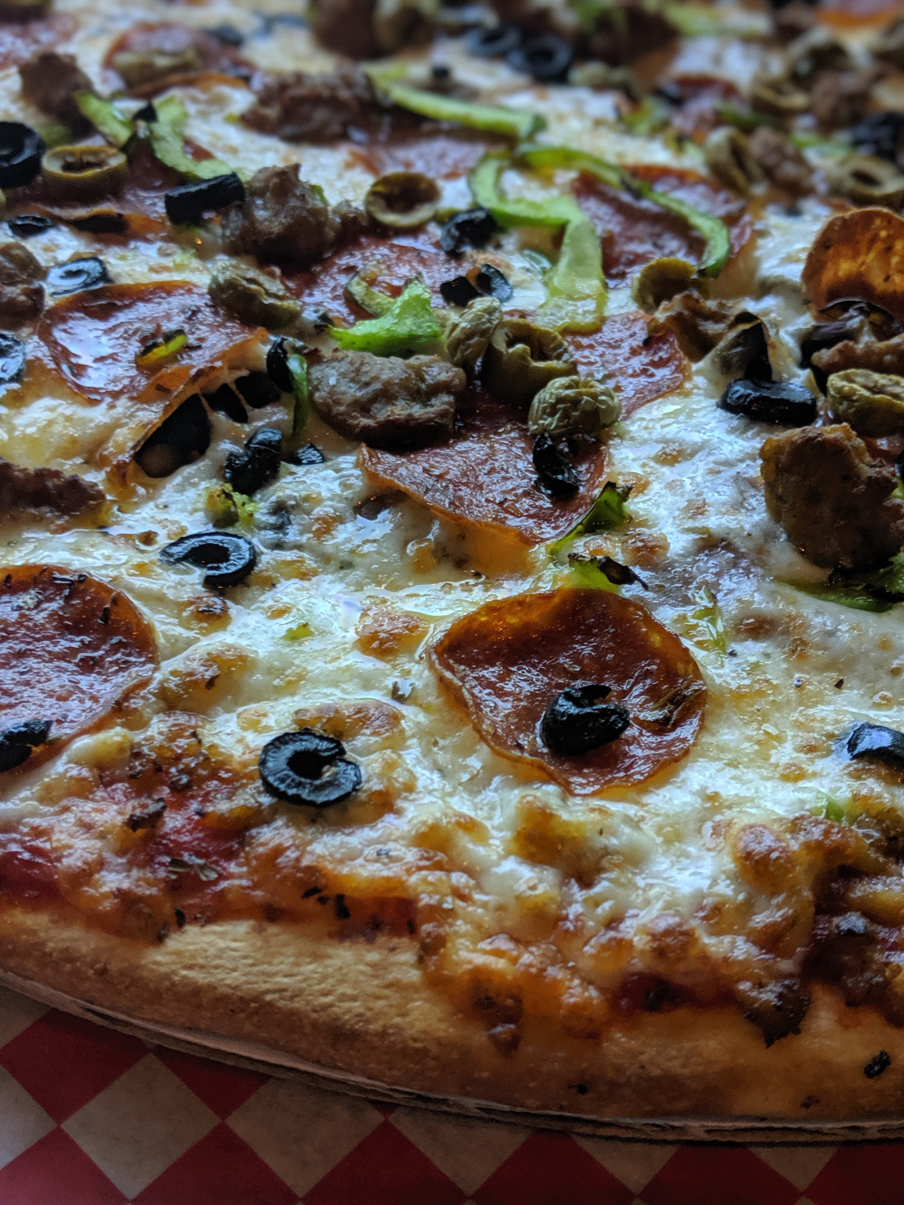 a pizza sitting on top of a pan