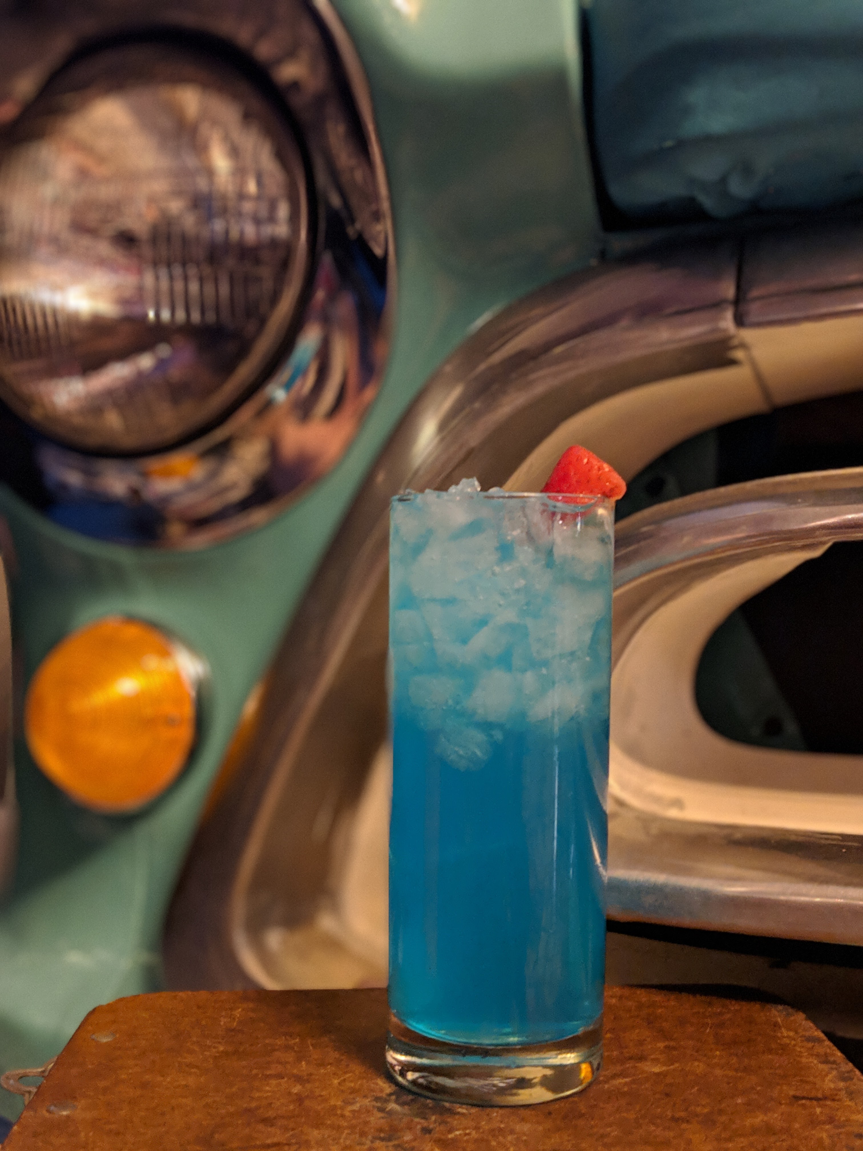 a glass with a blue car