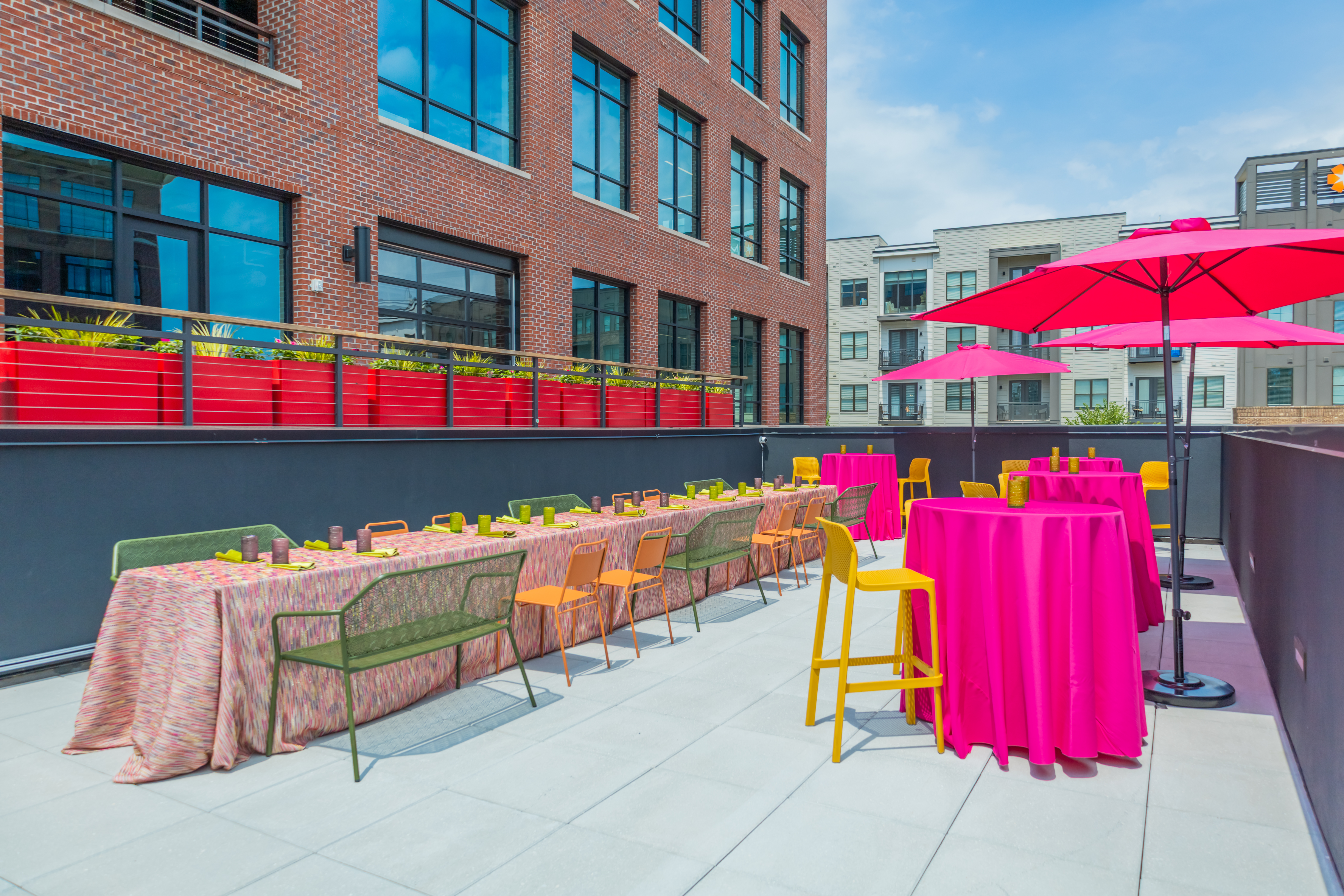a row of colorful umbrellas sitting next to a building