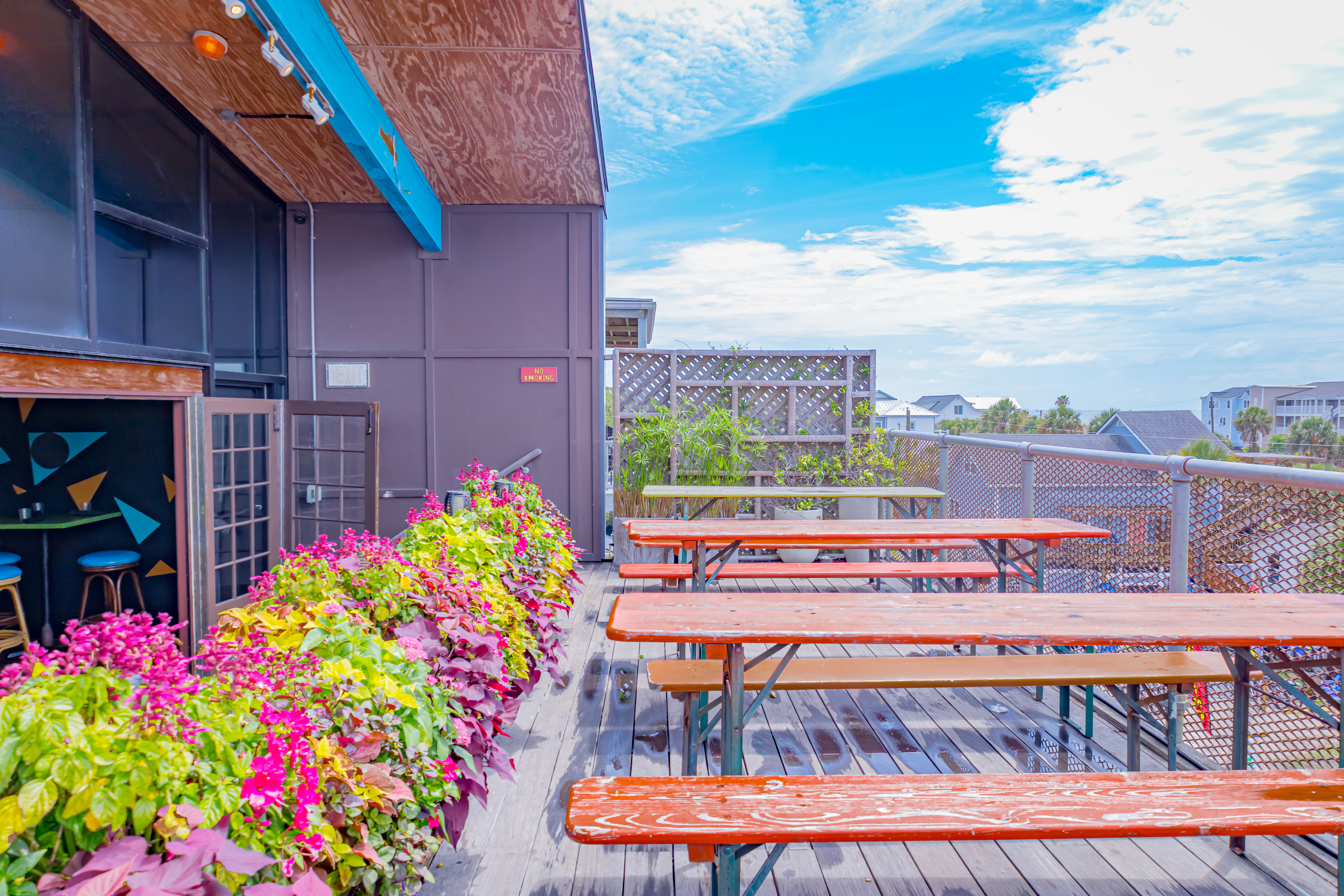 a wooden bench sitting in front of a building