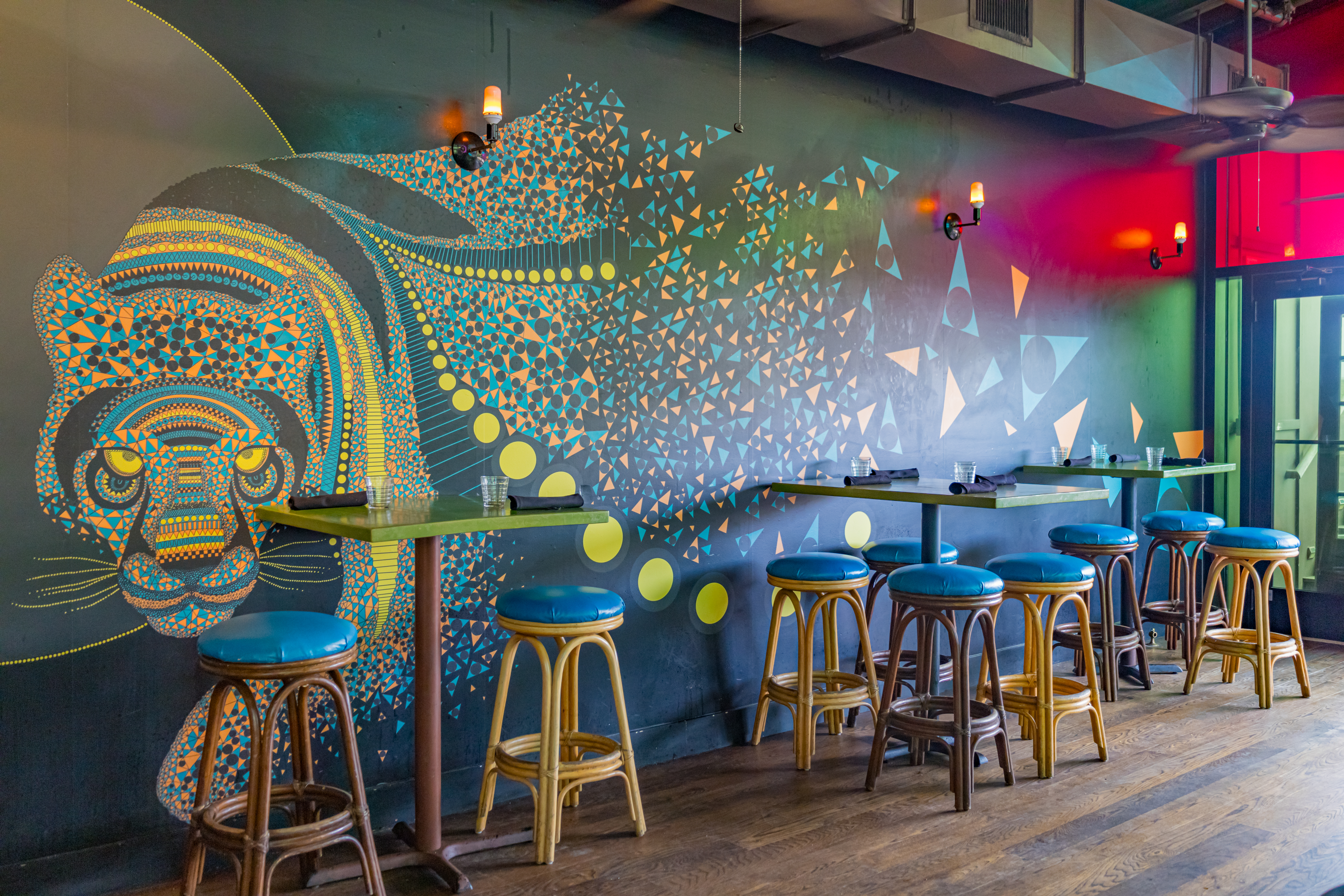 a group of people sitting at a table with a blue chair