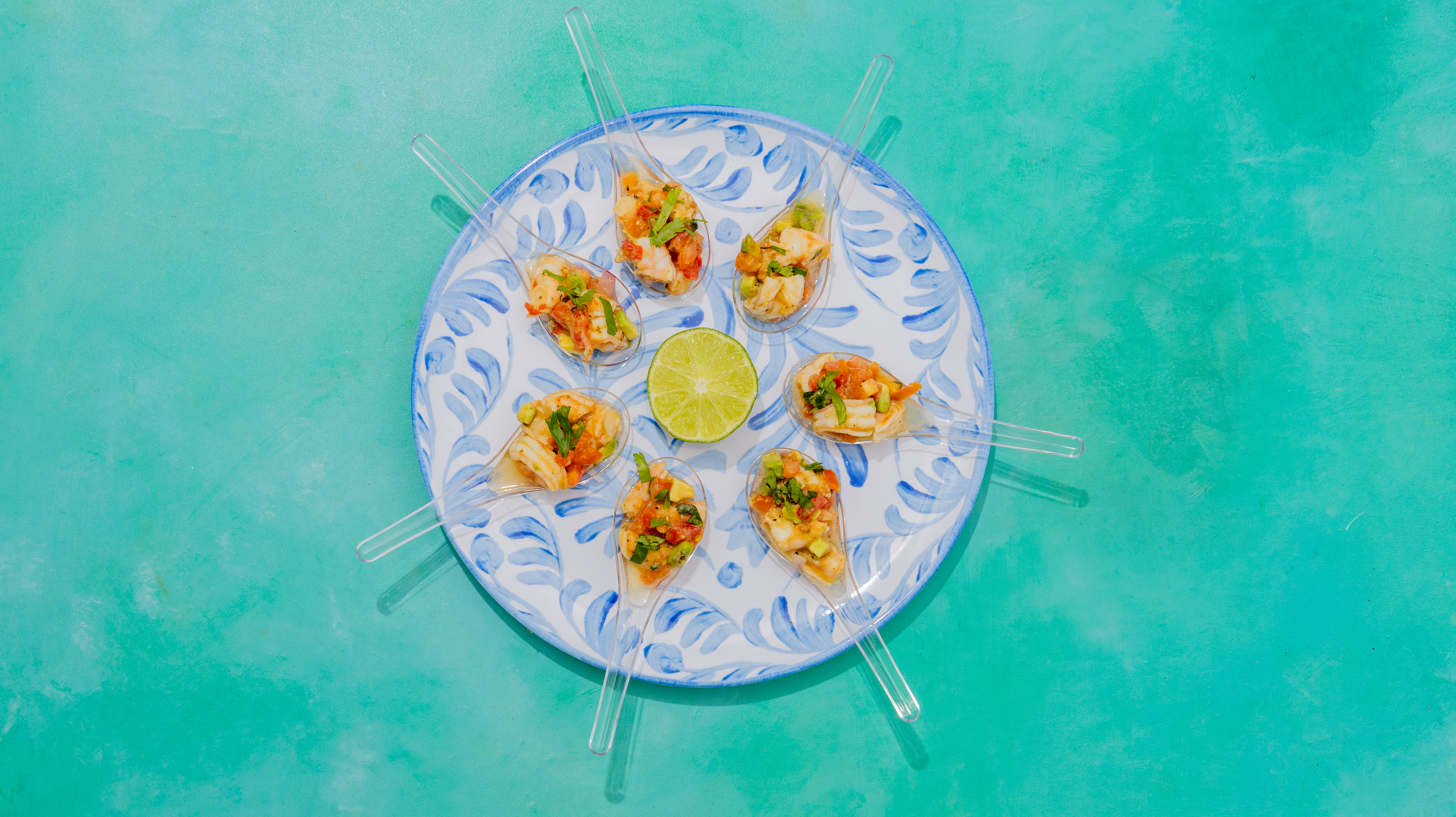 a plate with spoons of food on it