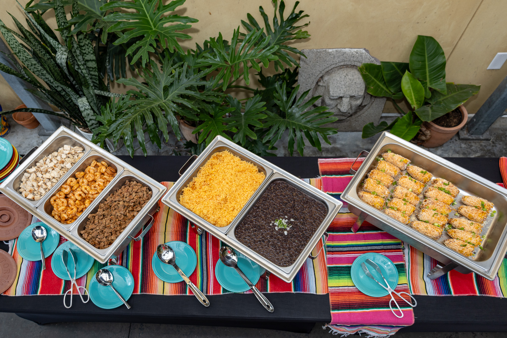 a group of food in metal containers on a table