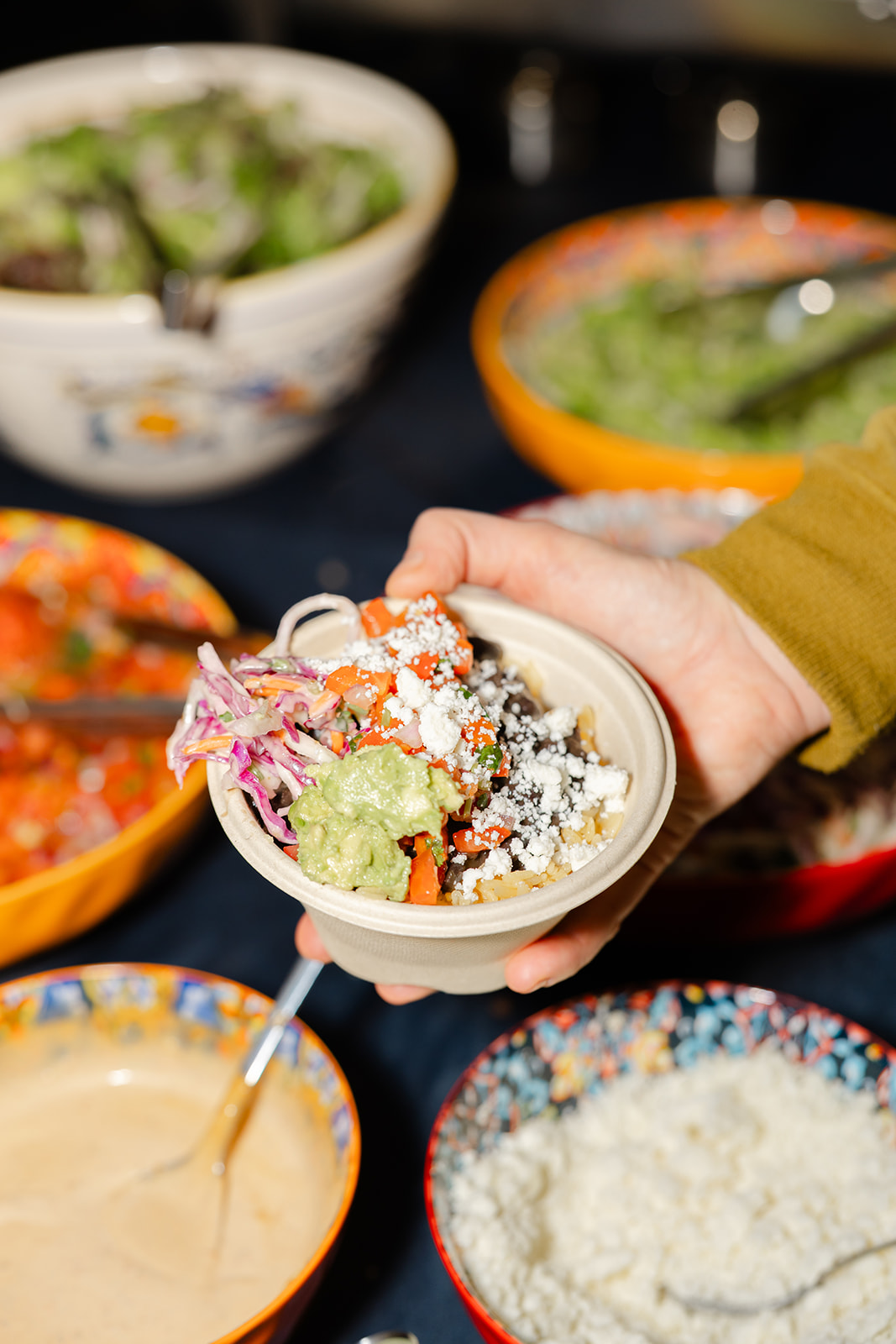 a person holding a bowl of food