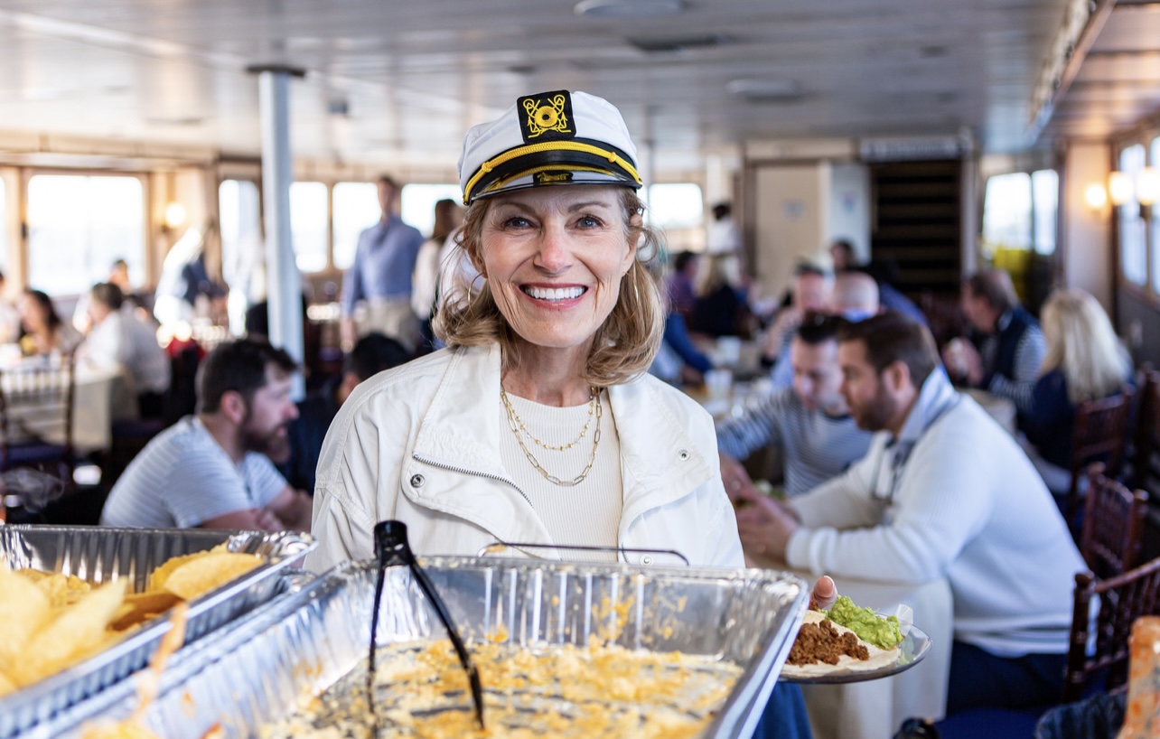 a woman holding a tray of food