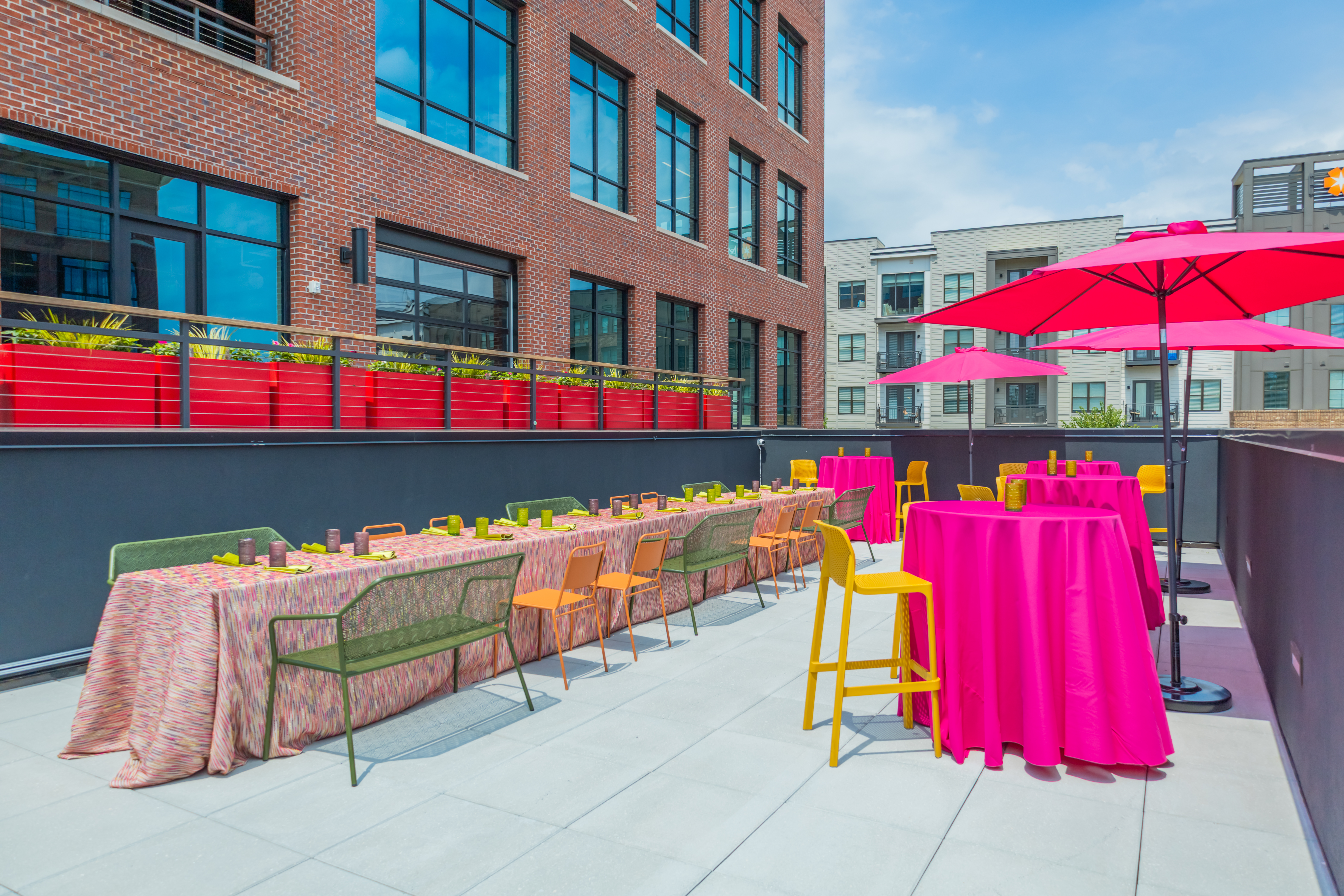 a row of colorful umbrellas sitting next to a building