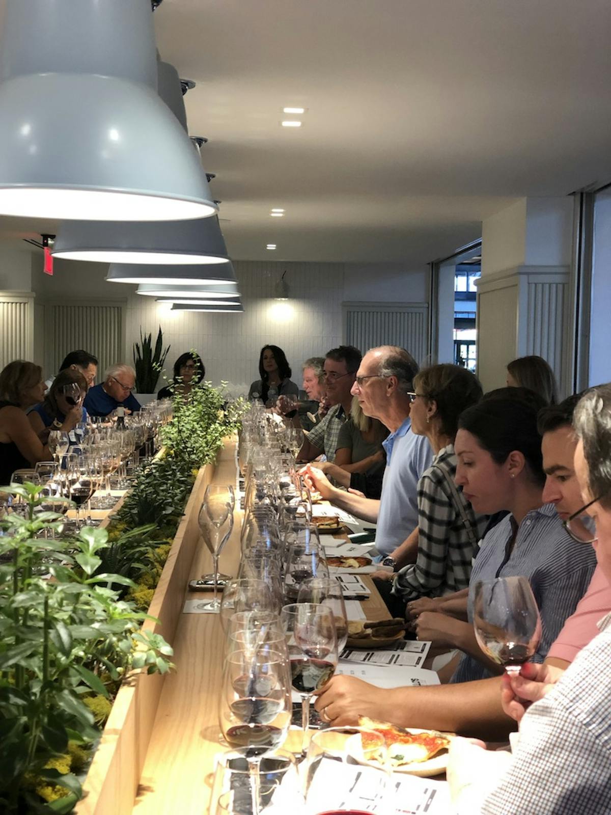 a group of people sitting at a table in a restaurant