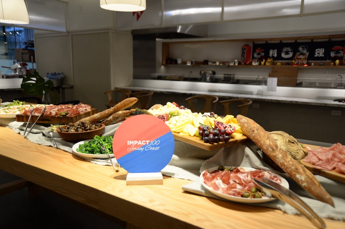 a kitchen with a lot of food on a table